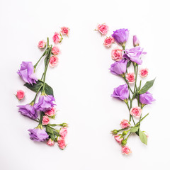Flowers composition. Frame made of pink and purple flowers. Valentine's Day. Flat lay, top view