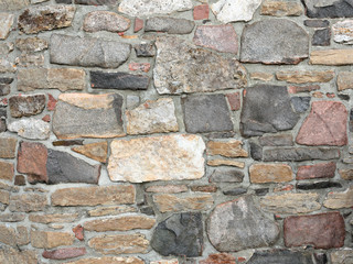 Stonework in rows with mortar in many colors
