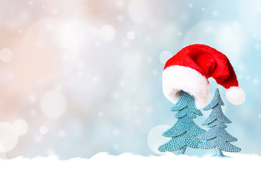 Christmas tree in Santa hat and Christmas decoration background