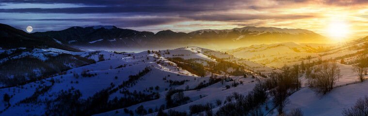 day and night time change concept in gorgeous panorama of mountainous countryside in winter. snow...