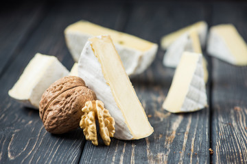 pieces of camembert cheese with nut