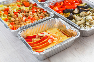 Healthy food take away, top view at wood background
