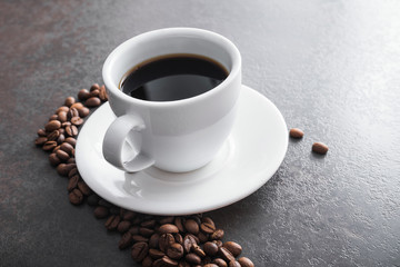 white ceramic cup with black coffee