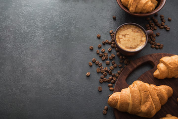 delicious croissant with a cup of coffee
