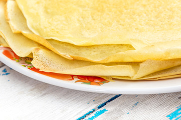Thin pancakes on the plate. Close up.