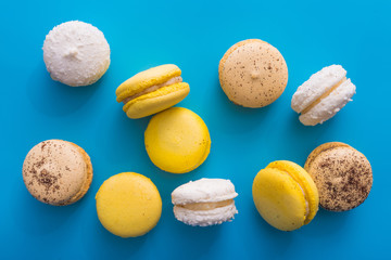 sweet french macaron cake on a blue table
