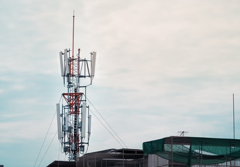 Mobile phone towers and 4G system installed on the roof 3G house in the community.