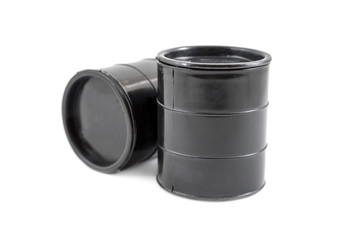 Two decorative black fuel oil barrel on white.