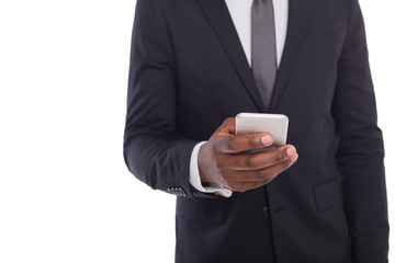 Unrecognizable businessman in suit with smartphone