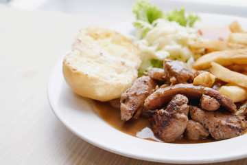 Pepper pork steak with French fried and salad