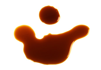 Puddle of soy sauce, white background