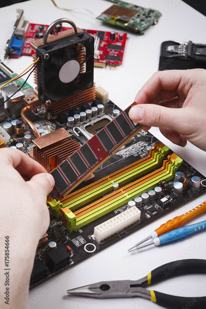 Poster technician plug in microprocessor to motherboard