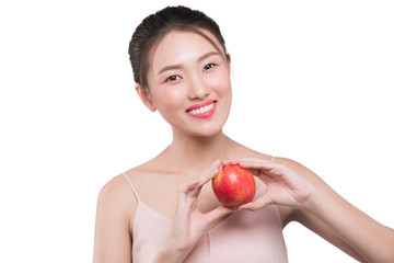 Smiling woman with healthy teeth holding red apple