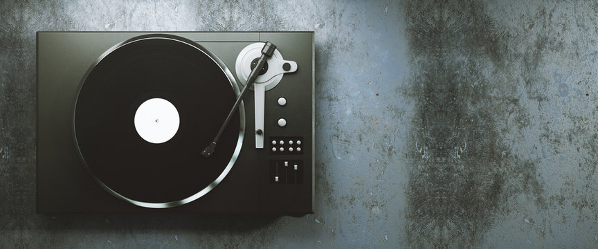 Vinyl record player on concrete background