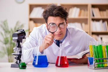 Mad crazy scientist doctor doing experiments in a laboratory
