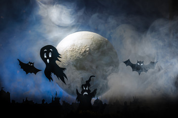 Halloween, ghosts against the background of the big moon