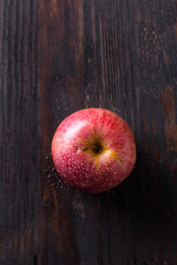 Red apple on wooden table