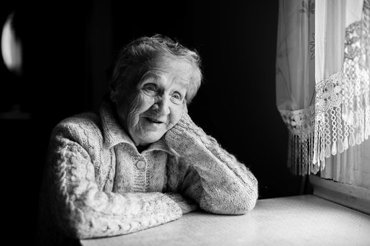 Black and white contrast portrait of an elderly woman.