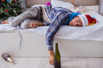 Man suffering hangover after christmas party