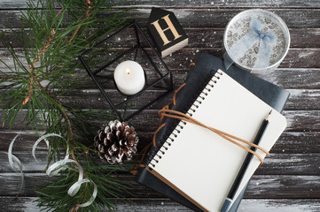 Christmas tree, empty open notebook and xmas decor