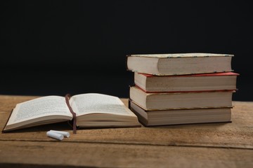 Books and chalk on table