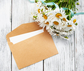 bouquet of daisies with envelope