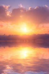 A very beautiful heavenly sunset with colorful clouds over the sea.