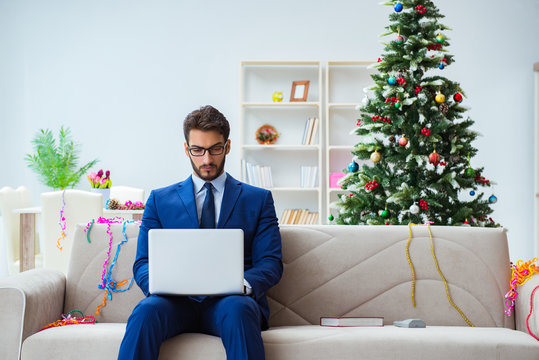 Businessman Working At Home During Christmas