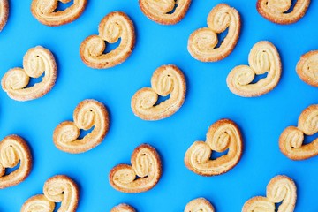 Delicious cookies with sugar on a blue background