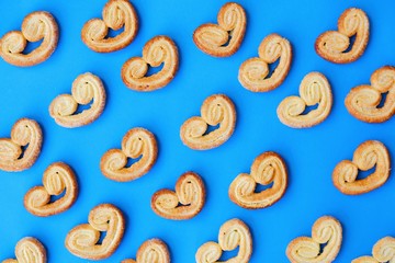 Delicious cookies with sugar on a blue background