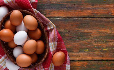Fresh chicken eggs on rustic wood copy space