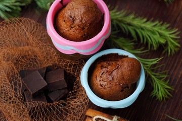 Delicious chocolate cupcakes with cinnamon on the table
