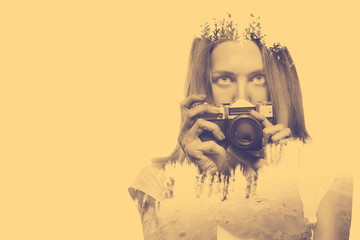 Double exposure of young woman holding old camera and nature background