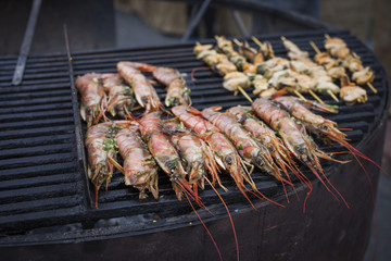 Grilled shrimps on the flaming grill.