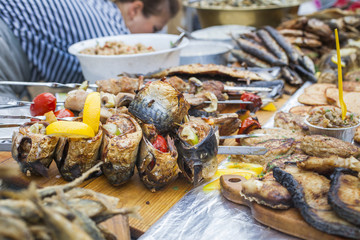 Fresh fried and baked fish on the counter