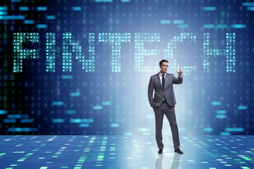 Businessman pressing buttons in fintech concept