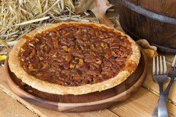 Whole Pecan Pie on a Rustic Wooden Surface