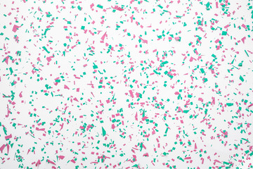 Confetti in christmas decoration color on white background.flat lay