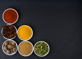 Big set of Asian spices on a black background