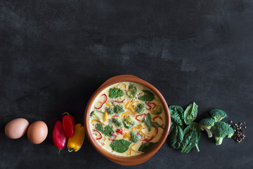 Fresh omelette prepared with vegetables and spinach