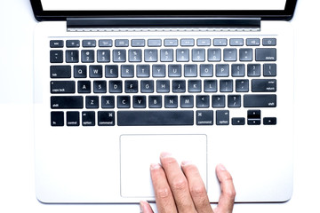 Top view, Male's hand working by using and typing on white laptop with blank white screen. Isolated on white background with clipping path.