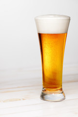 Glass of beer on white