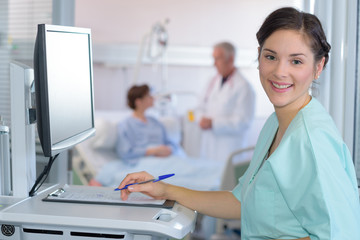 nurse with stethoscope looking at the camera