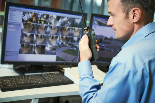 Security worker with radios. Video surveillance system.