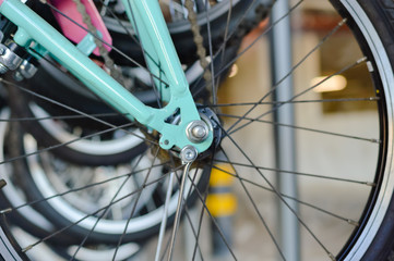 Close up on modern bikes detail over show room abstract shelf background, mobility cycle range