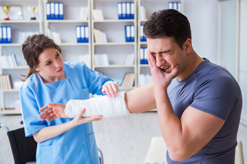 Doctor and patient during check-up for injury in hospital