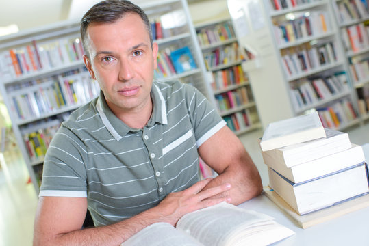 Portrait of middle aged man in library