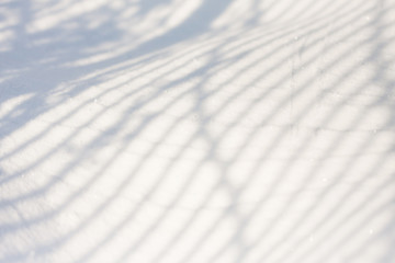 Snow texture with shadows - stripes from a fence
