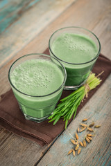 Two green barley grass shots