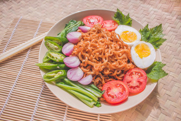 Delicious Fried Noodles on Unique Bamboo Woven Table 